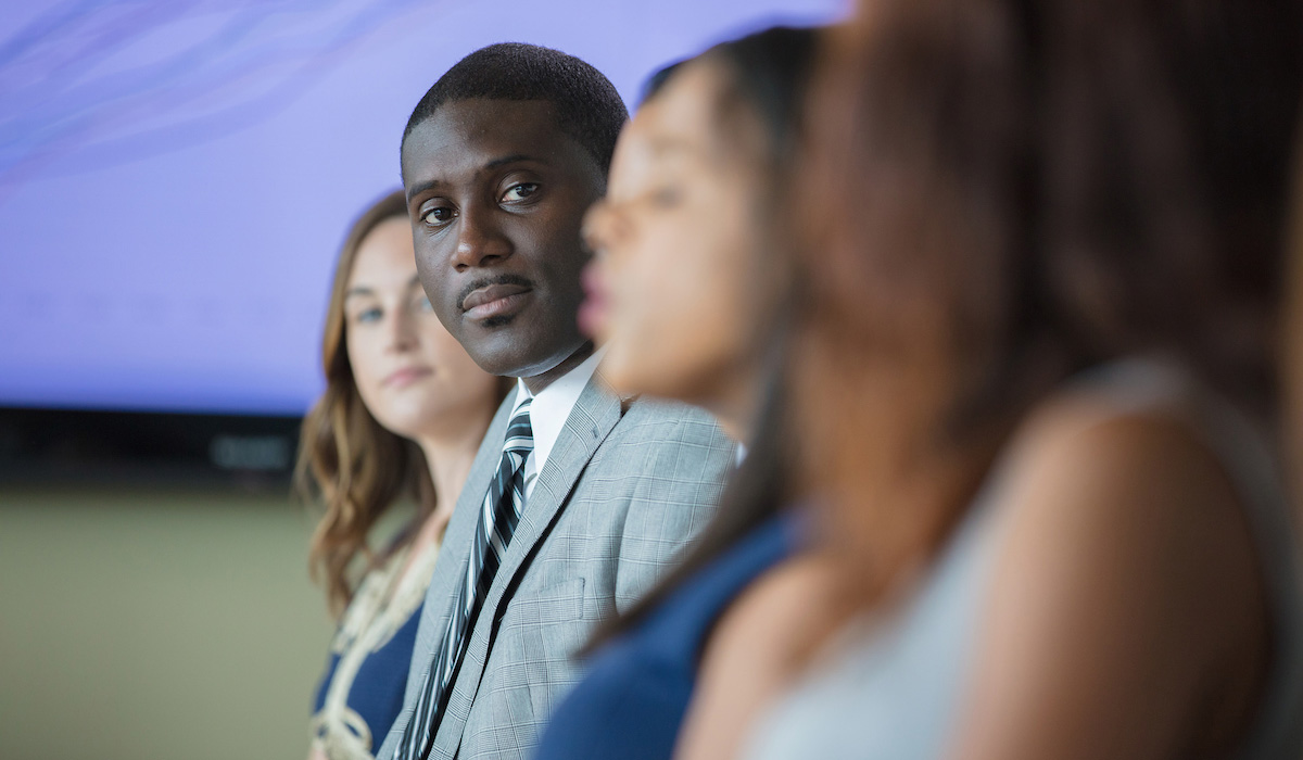 professional photo of man in corporate meeting