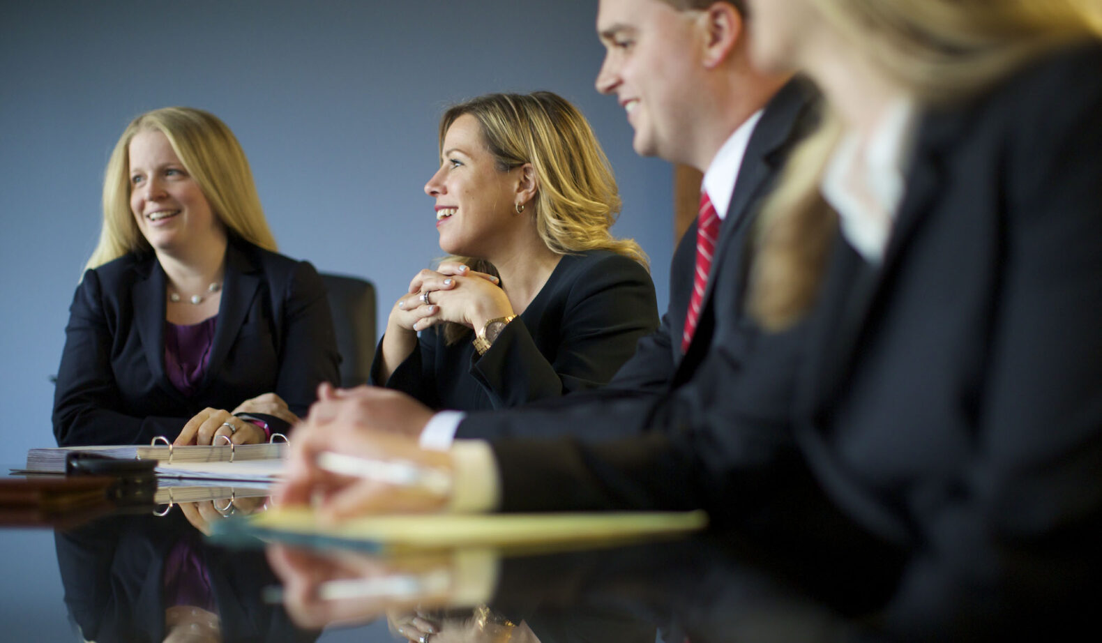 professional photo of corporate employees interacting in a business meeting