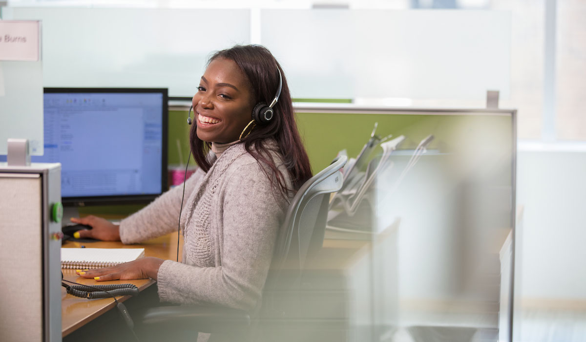 professional photo of corporate employee smiling taking calls