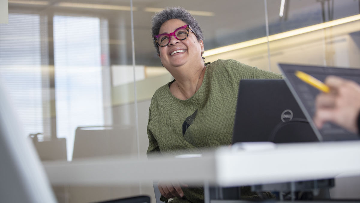 corporate employee smiling during meeting