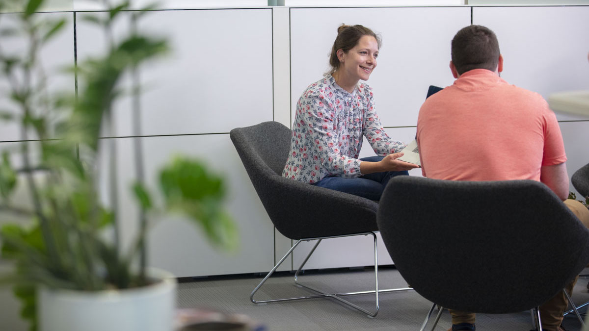 corporate employees candid collaboration during meeting