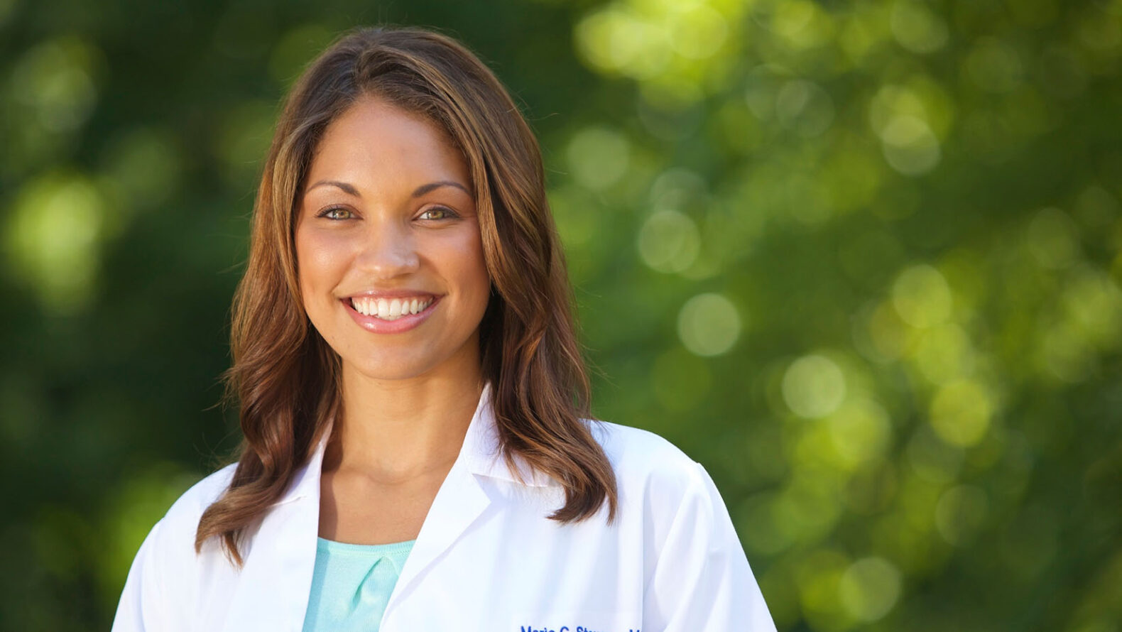 portrait of female doctor with natural backdrop