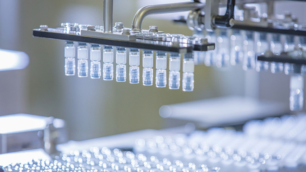 Liquid filled test tubes in holder at manufacturing facility