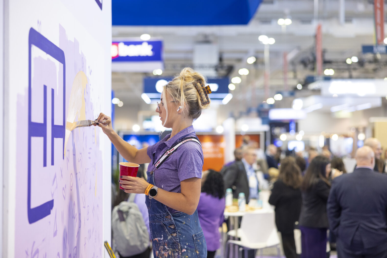 artist painting exhibit at corporate event