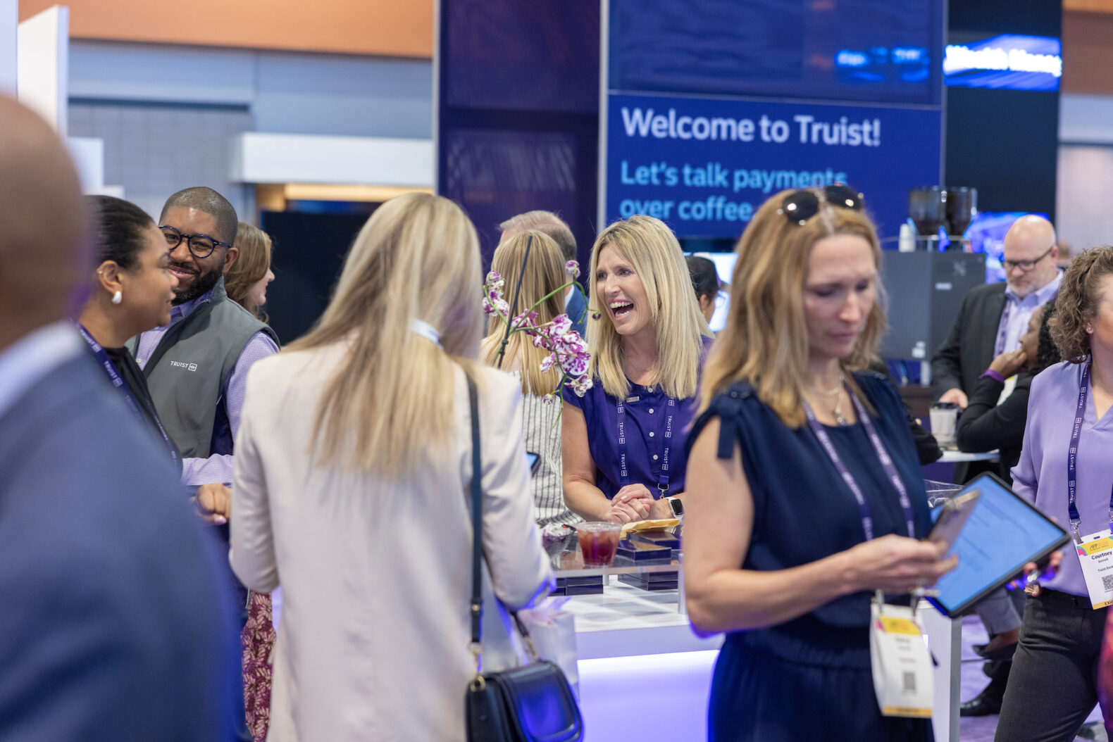 lady smiling in the middle of corporate event