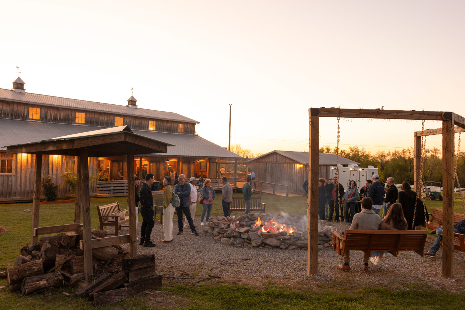 employees mingling by bonfire at corporate event